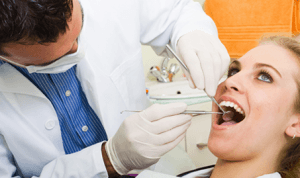 orthodontist checking- difference between dentist and orthodontist