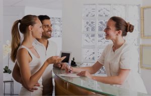 What patients want from their dentist - patients talking with dental reception desk