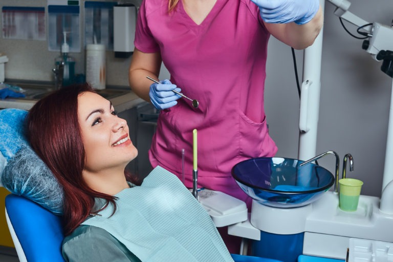 A lady in clinic for Proffesional teeth cleaning