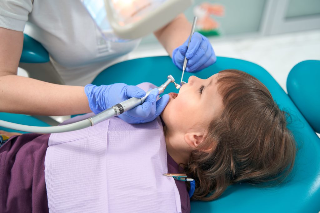 young girl at a dental hygienist appointment