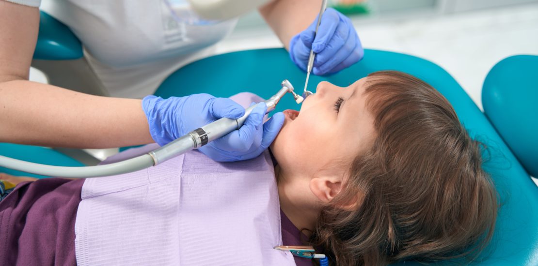 young girl at a dental hygienist appointment