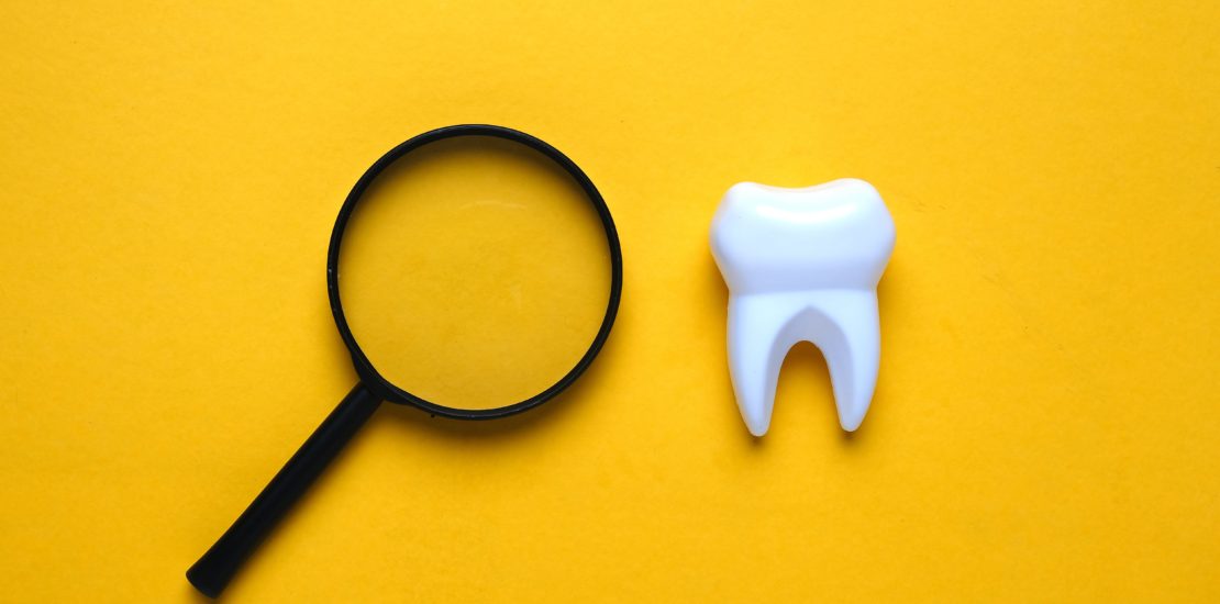 picture of tooth and spyglass demonstrating other health conditions you can find during a Cheadle dental appointment