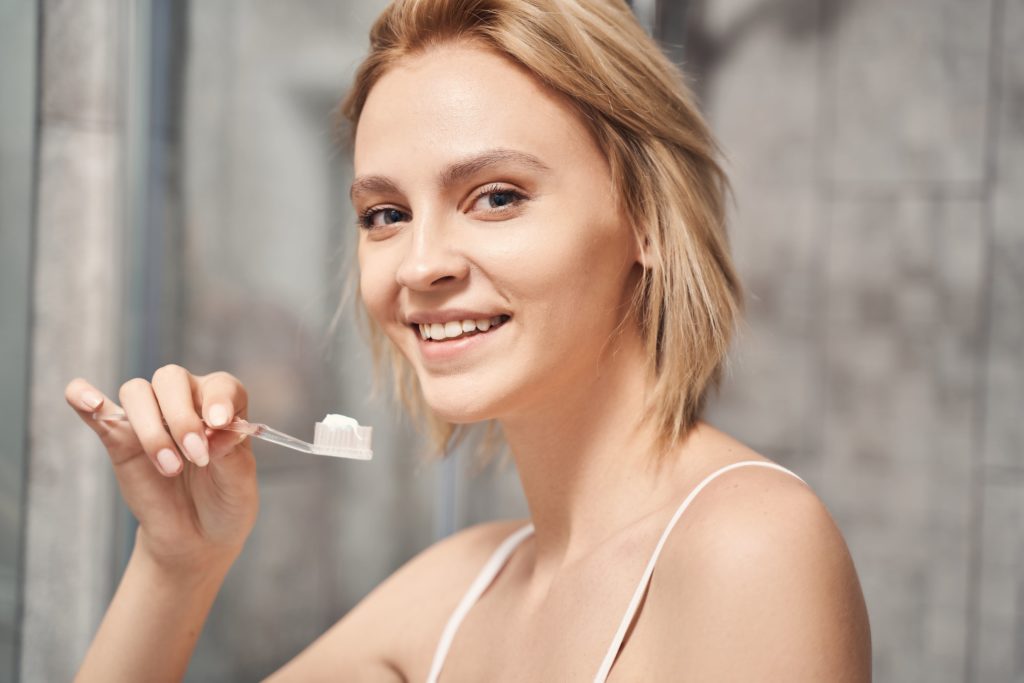 woman looking after her oral well-being