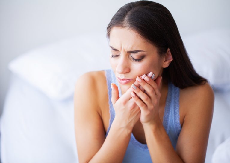 woman with tooth sensitivity