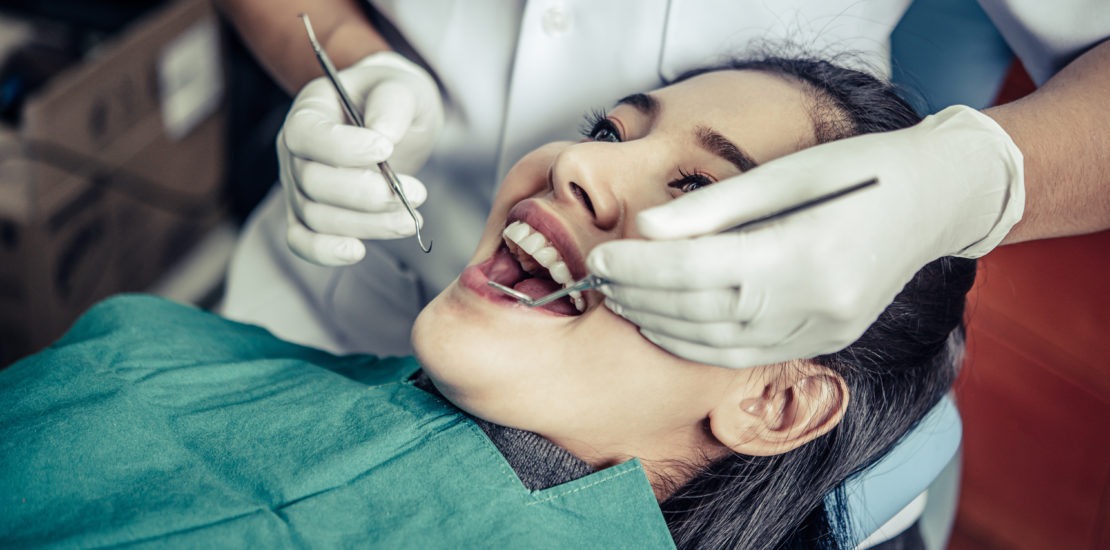 dentists treat patients teeth