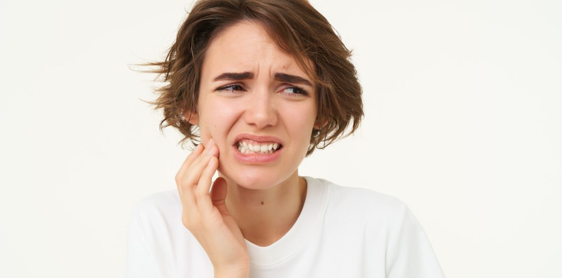 woman having tooth pain